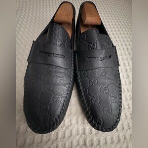 Gucci Embossed Black Leather Slip-On Loafers